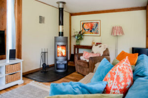 Wood burner in living room at The Lodge